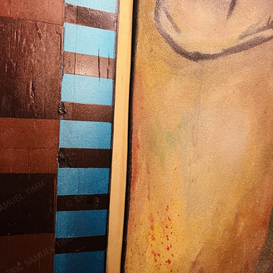 Macro detail of the hand-built card frame, painted stripes and a gilded edge