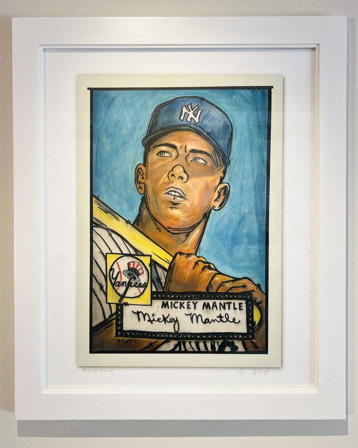 Framed Mickey Mantle print, double-matted in a wide white frame, hanging on a white wall